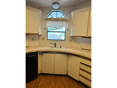 This 2-bedroom, 2-bathroom home offers a perfect place for on Lake Henry Golf Club in Florida - for sale on GolfHomes.com, golf home, golf lot