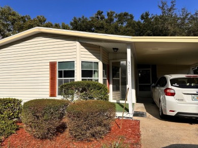 This home has a 1 yr old roof and AC unit!! Water heater only 4 on Whisperwood Golf Course in Florida - for sale on GolfHomes.com, golf home, golf lot