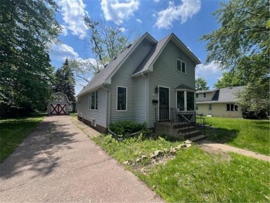 In the heart of town, this 2 story is nestled in between mature on The Amery Golf Club in Wisconsin - for sale on GolfHomes.com, golf home, golf lot