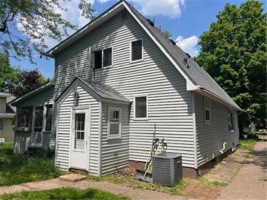In the heart of town, this 2 story is nestled in between mature on The Amery Golf Club in Wisconsin - for sale on GolfHomes.com, golf home, golf lot
