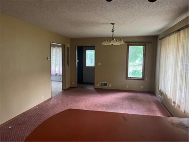 In the heart of town, this 2 story is nestled in between mature on The Amery Golf Club in Wisconsin - for sale on GolfHomes.com, golf home, golf lot