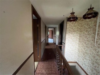 In the heart of town, this 2 story is nestled in between mature on The Amery Golf Club in Wisconsin - for sale on GolfHomes.com, golf home, golf lot