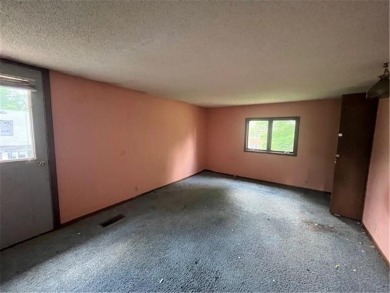 In the heart of town, this 2 story is nestled in between mature on The Amery Golf Club in Wisconsin - for sale on GolfHomes.com, golf home, golf lot