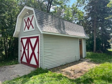In the heart of town, this 2 story is nestled in between mature on The Amery Golf Club in Wisconsin - for sale on GolfHomes.com, golf home, golf lot