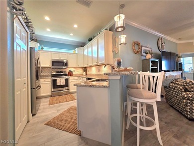 Welcome to a villa that understands the assignment; effortless on Pelican Preserve Golf Club in Florida - for sale on GolfHomes.com, golf home, golf lot