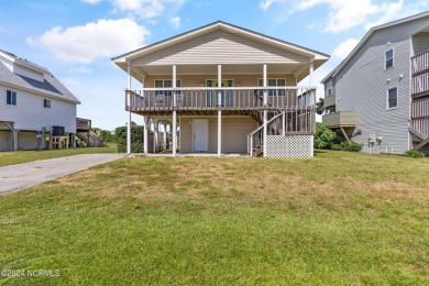 Price Reduction! Enjoy a third-row beach home that has a dock on on Founders Club At St. James Plantation in North Carolina - for sale on GolfHomes.com, golf home, golf lot