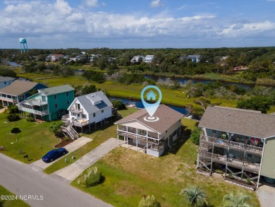 Price Reduction! Enjoy a third-row beach home that has a dock on on Founders Club At St. James Plantation in North Carolina - for sale on GolfHomes.com, golf home, golf lot