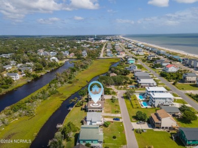 Price Reduction! Enjoy a third-row beach home that has a dock on on Founders Club At St. James Plantation in North Carolina - for sale on GolfHomes.com, golf home, golf lot