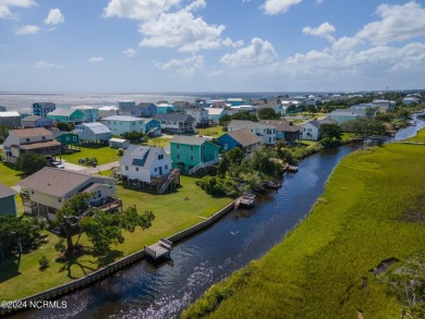 Price Reduction! Enjoy a third-row beach home that has a dock on on Founders Club At St. James Plantation in North Carolina - for sale on GolfHomes.com, golf home, golf lot