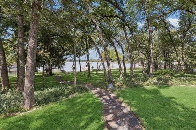 This beautifully maintained, one-owner home sits on just under on The Golf Club at Resort Eagle Mountain Lake in Texas - for sale on GolfHomes.com, golf home, golf lot