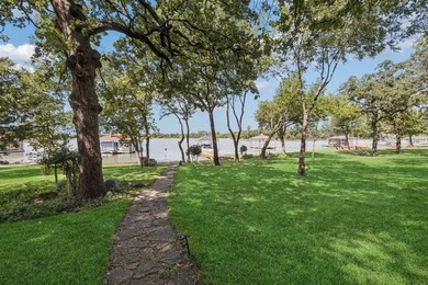 This beautifully maintained, one-owner home sits on just under on The Golf Club at Resort Eagle Mountain Lake in Texas - for sale on GolfHomes.com, golf home, golf lot