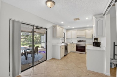 Open floor plan overlooking pool and golf course.  Besides the on Boca Greens Country Club in Florida - for sale on GolfHomes.com, golf home, golf lot
