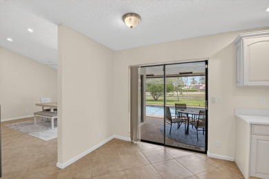 Open floor plan overlooking pool and golf course.  Besides the on Boca Greens Country Club in Florida - for sale on GolfHomes.com, golf home, golf lot