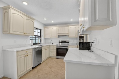 Open floor plan overlooking pool and golf course.  Besides the on Boca Greens Country Club in Florida - for sale on GolfHomes.com, golf home, golf lot