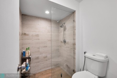This beautifully and totally updated 2-bed, 2-bath townhouse on Woodmont Country Club in Florida - for sale on GolfHomes.com, golf home, golf lot