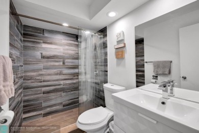 This beautifully and totally updated 2-bed, 2-bath townhouse on Woodmont Country Club in Florida - for sale on GolfHomes.com, golf home, golf lot