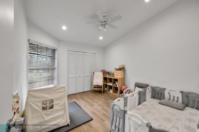 This beautifully and totally updated 2-bed, 2-bath townhouse on Woodmont Country Club in Florida - for sale on GolfHomes.com, golf home, golf lot