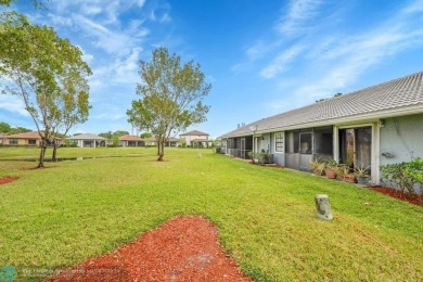 This beautifully and totally updated 2-bed, 2-bath townhouse on Woodmont Country Club in Florida - for sale on GolfHomes.com, golf home, golf lot