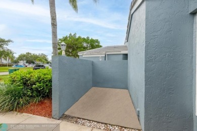 This beautifully and totally updated 2-bed, 2-bath townhouse on Woodmont Country Club in Florida - for sale on GolfHomes.com, golf home, golf lot