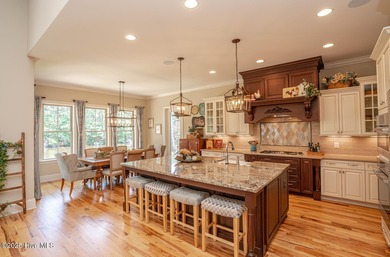 Stunning one-of-a-kind custom stone beauty with pond/golf course on Ocean Ridge Plantation in North Carolina - for sale on GolfHomes.com, golf home, golf lot