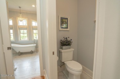 Incredible attention to detail in this custom stone beauty on Ocean Ridge Plantation in North Carolina - for sale on GolfHomes.com, golf home, golf lot