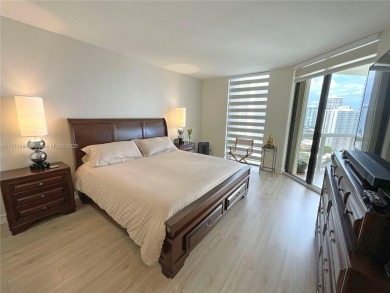 Experience luxury living with million-dollar views in this on Turnberry Isle Resort and Club in Florida - for sale on GolfHomes.com, golf home, golf lot