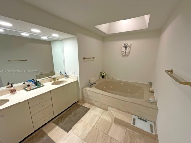 Experience luxury living with million-dollar views in this on Turnberry Isle Resort and Club in Florida - for sale on GolfHomes.com, golf home, golf lot