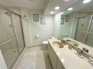 Experience luxury living with million-dollar views in this on Turnberry Isle Resort and Club in Florida - for sale on GolfHomes.com, golf home, golf lot