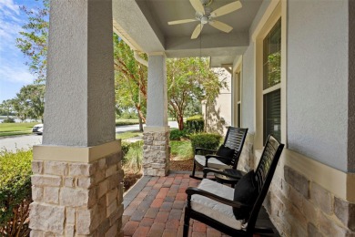 Welcome home to your stunning front porch LAKE VIEWS, on this on Orange County National Golf Center and Lodge in Florida - for sale on GolfHomes.com, golf home, golf lot