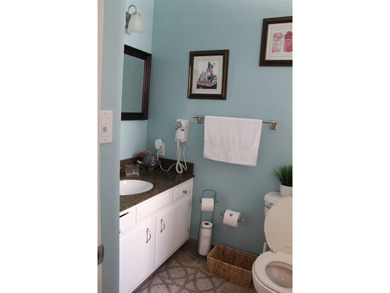 Welcome to this charming 2-bedroom, 2.5-bath condominium located on Errol Estates Country Club in Florida - for sale on GolfHomes.com, golf home, golf lot