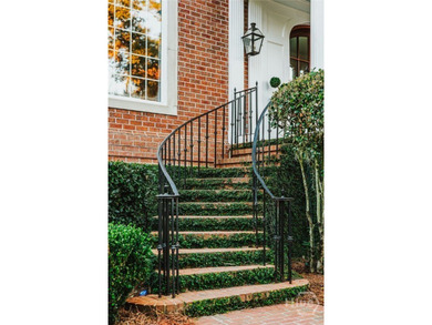 Midpoint Masterpiece - where mornings begin on the porch and on The Landings Club - Palmetto in Georgia - for sale on GolfHomes.com, golf home, golf lot