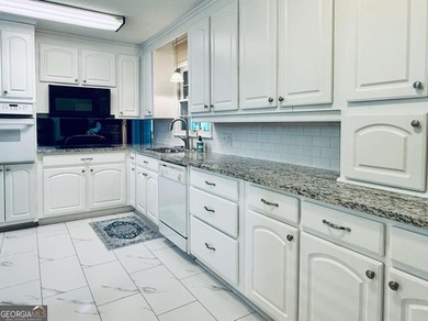 This 4 bedroom, 3 bath ranch has perfect bones and a great floor on Cherokee Golf and Country Club in Georgia - for sale on GolfHomes.com, golf home, golf lot