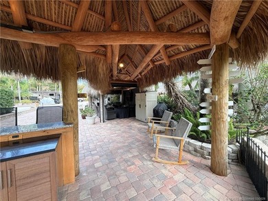 Enjoy sweeping panoramic views from this exceptional 3,031 sq ft on St. Lucie Trail Golf Club in Florida - for sale on GolfHomes.com, golf home, golf lot