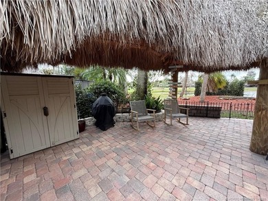 Enjoy sweeping panoramic views from this exceptional 3,031 sq ft on St. Lucie Trail Golf Club in Florida - for sale on GolfHomes.com, golf home, golf lot