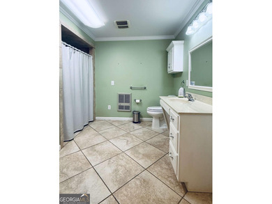 This 4 bedroom, 3 bath ranch has perfect bones and a great floor on Cherokee Golf and Country Club in Georgia - for sale on GolfHomes.com, golf home, golf lot