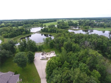 Nestled on a prime .82-acre parcel just steps from the serene on Geneva Golf Club in Minnesota - for sale on GolfHomes.com, golf home, golf lot