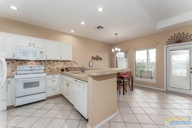 Well-maintained waterfront villa offering furnished, turn-key on South Padre Island Golf Club in Texas - for sale on GolfHomes.com, golf home, golf lot