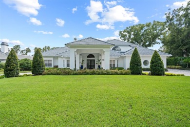 Stunning golf and lake views and beautifully updated grounds are on Isleworth Golf and Country Club in Florida - for sale on GolfHomes.com, golf home, golf lot