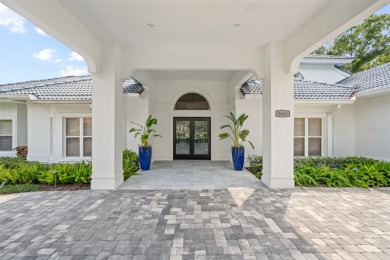 Stunning golf and lake views and beautifully updated grounds are on Isleworth Golf and Country Club in Florida - for sale on GolfHomes.com, golf home, golf lot