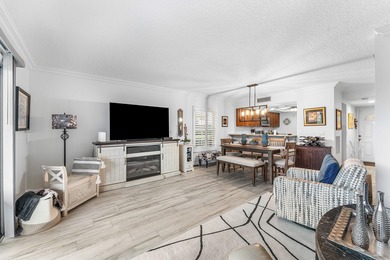 Immaculate first floor end-unit townhome showcasing tranquil on Riverbend Golf Club in Florida - for sale on GolfHomes.com, golf home, golf lot