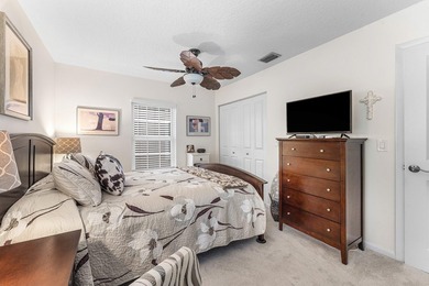 Immaculate first floor end-unit townhome showcasing tranquil on Riverbend Golf Club in Florida - for sale on GolfHomes.com, golf home, golf lot