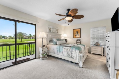 Immaculate first floor end-unit townhome showcasing tranquil on Riverbend Golf Club in Florida - for sale on GolfHomes.com, golf home, golf lot