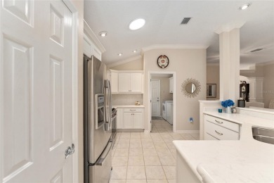 Welcome to this METICULOUSLY MAINTAINED LANTANA DESIGNER MODEL on The Links of Spruce Creek in Florida - for sale on GolfHomes.com, golf home, golf lot