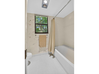 HIGHLY SOUGHT AFTER COURTSIDE 2 BEDROOM, 2 BATHROOM GROUND FLOOR on Boca West Golf and Country Club in Florida - for sale on GolfHomes.com, golf home, golf lot