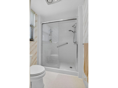 HIGHLY SOUGHT AFTER COURTSIDE 2 BEDROOM, 2 BATHROOM GROUND FLOOR on Boca West Golf and Country Club in Florida - for sale on GolfHomes.com, golf home, golf lot