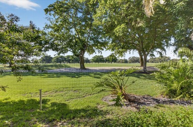 HIGHLY SOUGHT AFTER COURTSIDE 2 BEDROOM, 2 BATHROOM GROUND FLOOR on Boca West Golf and Country Club in Florida - for sale on GolfHomes.com, golf home, golf lot