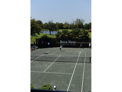 HIGHLY SOUGHT AFTER COURTSIDE 2 BEDROOM, 2 BATHROOM GROUND FLOOR on Boca West Golf and Country Club in Florida - for sale on GolfHomes.com, golf home, golf lot