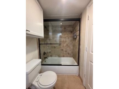 This spacious 2 bedroom, 2 bath condo with an open-concept on Royal Oaks Country Club in Texas - for sale on GolfHomes.com, golf home, golf lot