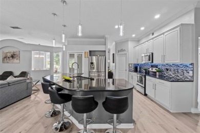 SELLERS ARE NOW PAYING OFF THE SOLAR PANELS AT CLOSING! SOLAR on Glen Abbey Golf Club in Florida - for sale on GolfHomes.com, golf home, golf lot