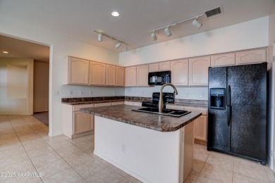 Lovely home located on a charming tree-lined street in the heart on StoneRidge Golf Course in Arizona - for sale on GolfHomes.com, golf home, golf lot